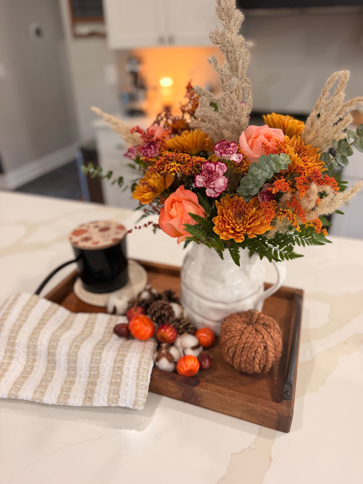 Amber Fields bouquet styled in a white pitcher; vase and props not included
