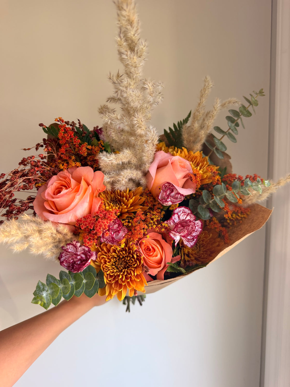 Amber Fields bouquet wrapped in kraft paper as it ships