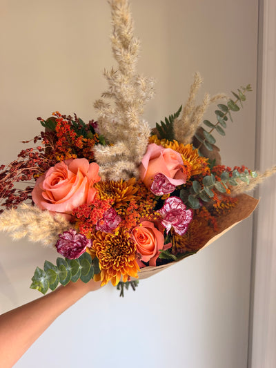 Amber Fields bouquet wrapped in kraft paper as it ships